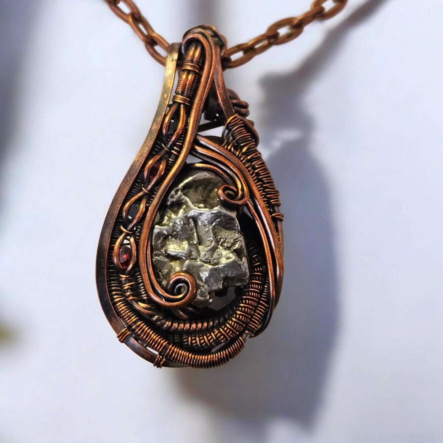 Copper Wrapped Metorite with Garnet Accent Stones