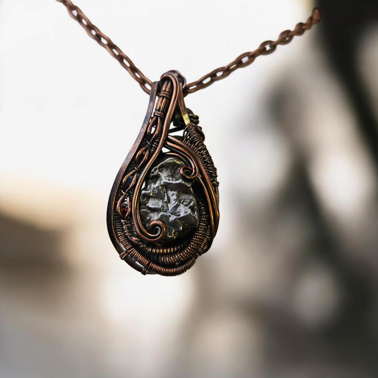 Copper Wrapped Metorite with Garnet Accent Stones